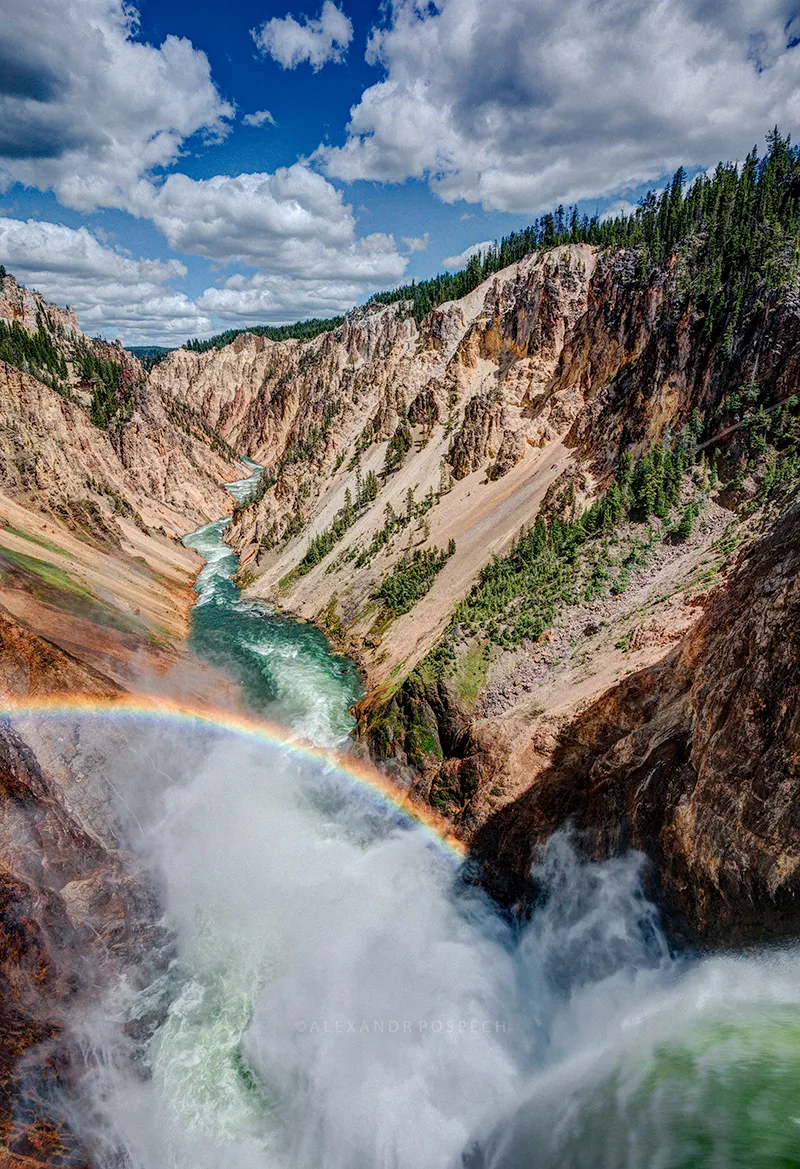 Photograph of the Upper Falls of the Yellowstone River with rainbow in Grand Canyon of Yellowstone